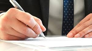 lawyer signing documents